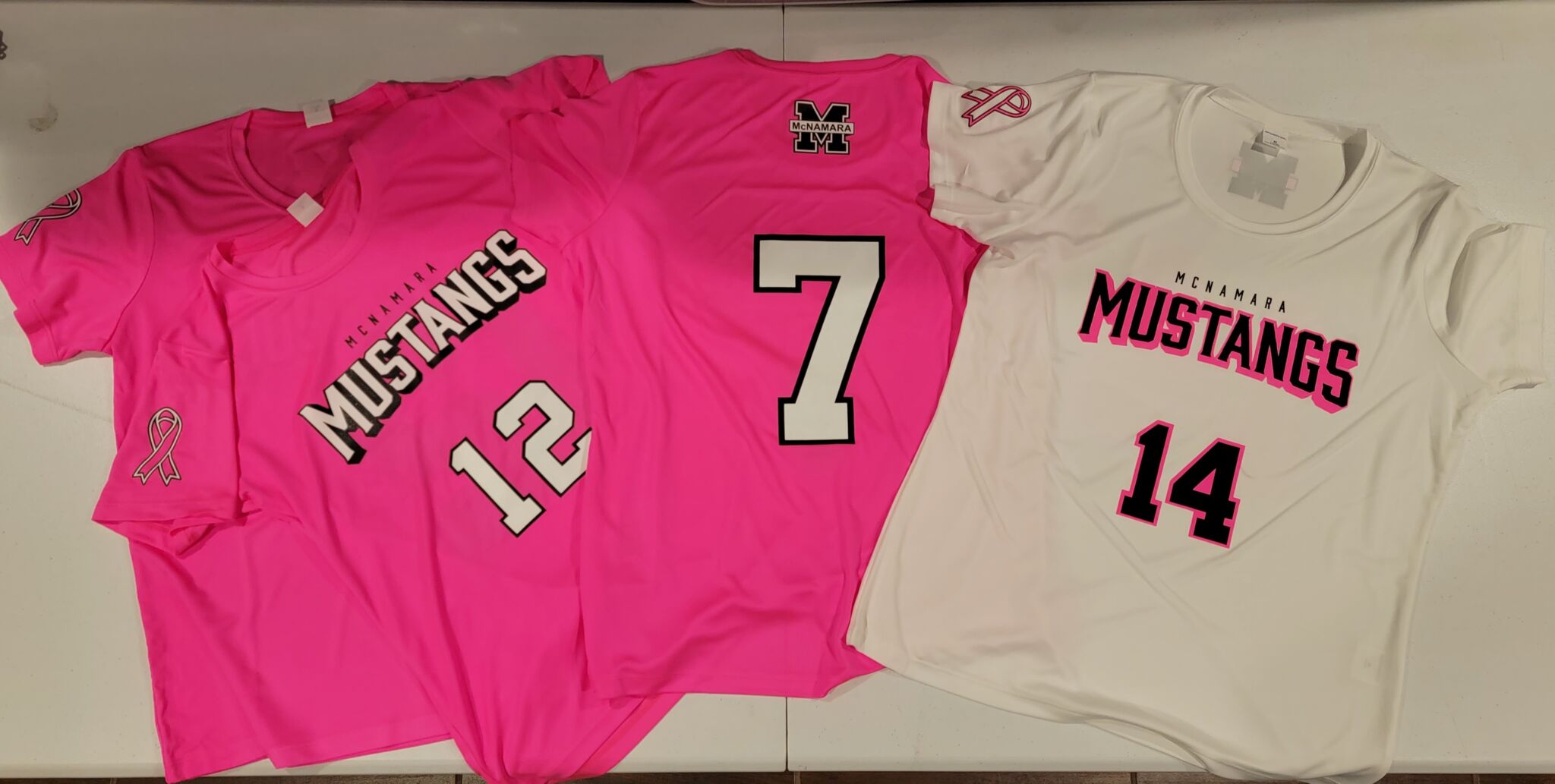 Custom volleyball jerseys for the McNamara Mustangs